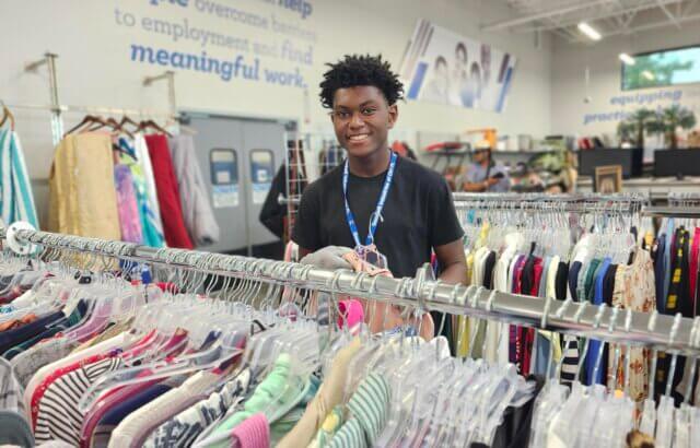 Transitioning Youth participant works at the Winter Garden Goodwill store
