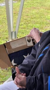 Photo of William James Magill, burial flag, and original box from the War Department in 1944